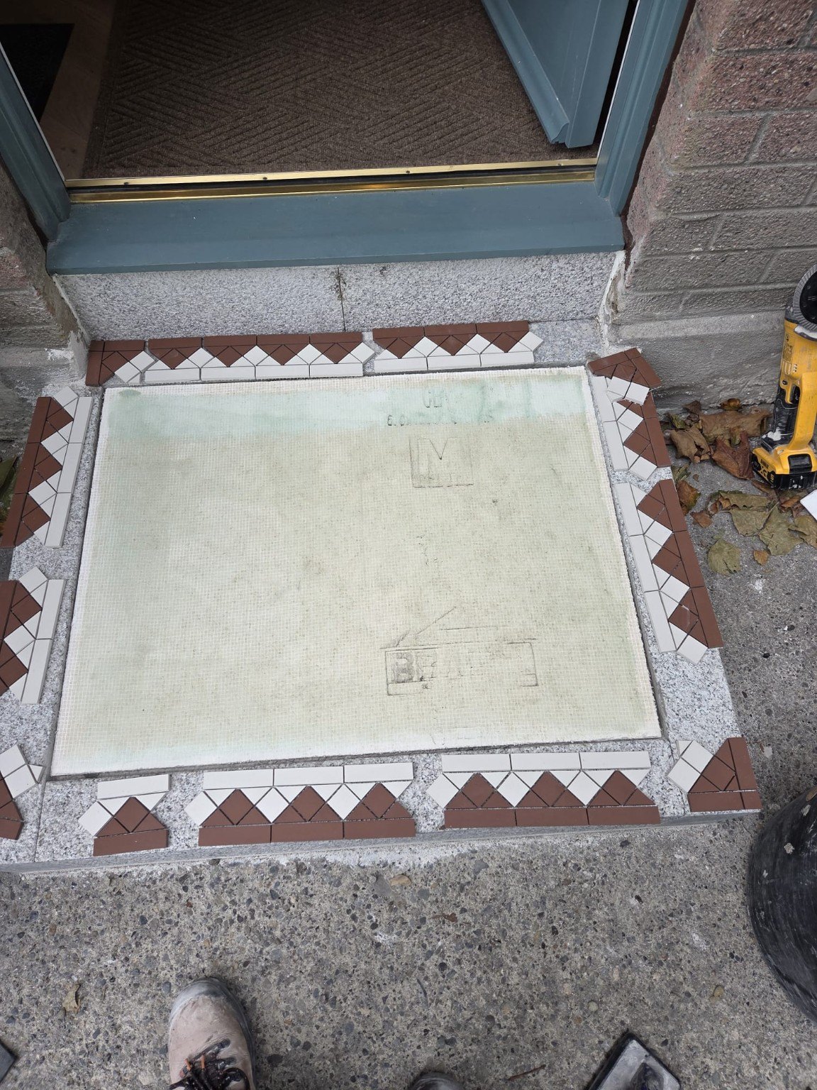 Entrance tiling before completion