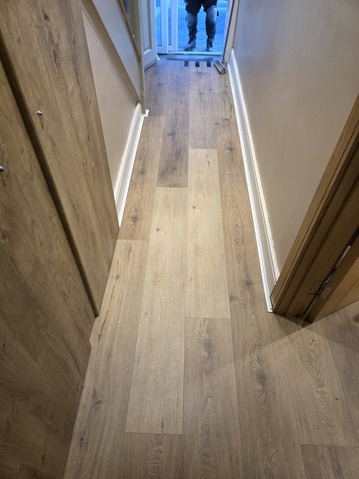 Wood-effect flooring installed in hallway